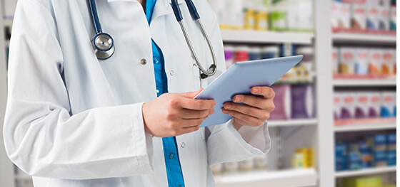 Pharmacology World Videos - pharmacist holding a tablet