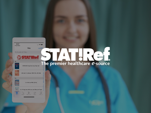 Male doctor looking at a tablet with a Stat!ref logo